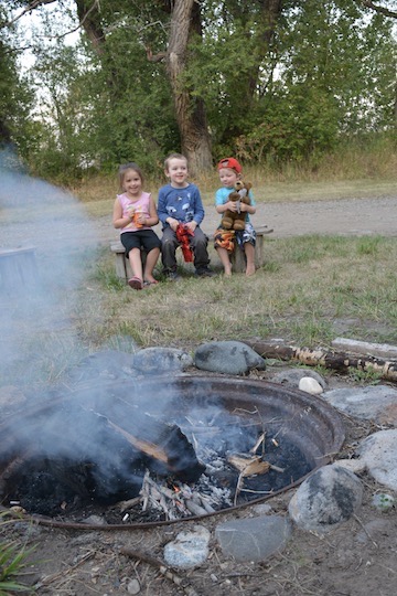 Edward at campfire with kids